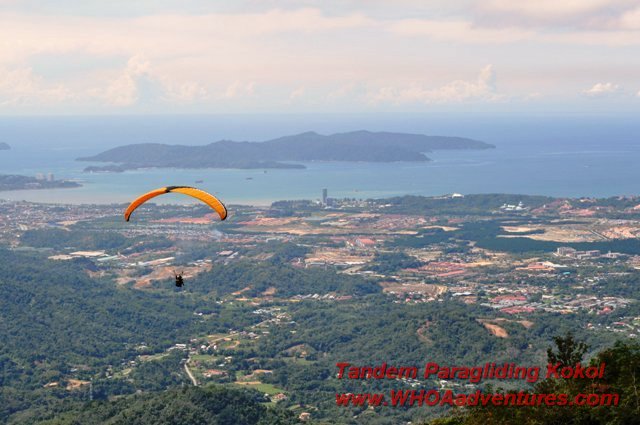 Paragliding over Menggatal with Kota Kinabalu City in a distance